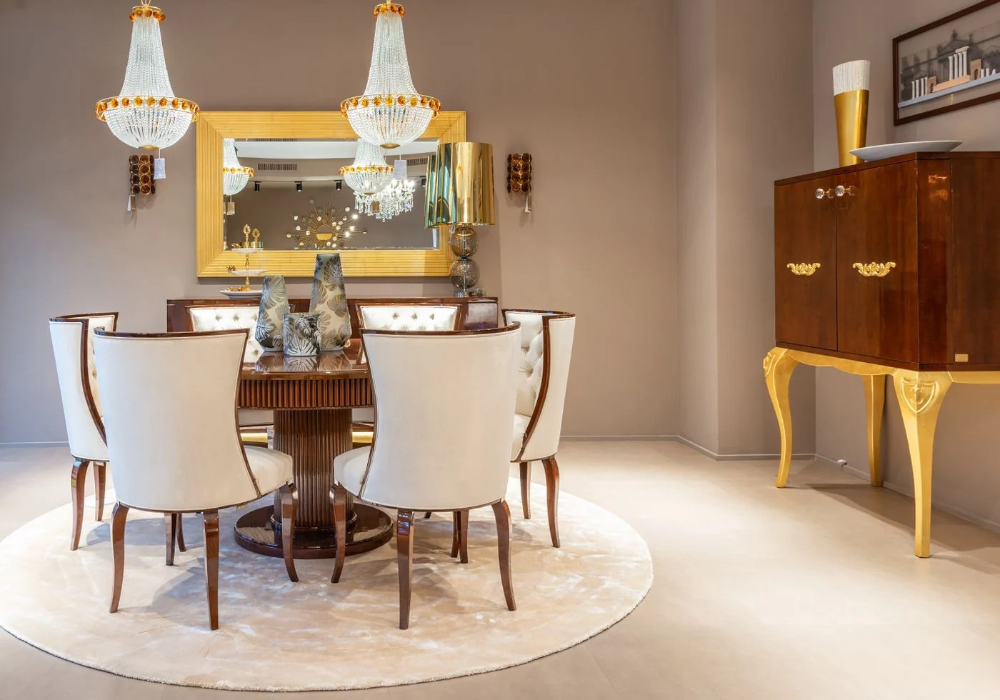 Charming dining room interior with vintage decor, featuring a round table and chandelier lighting.