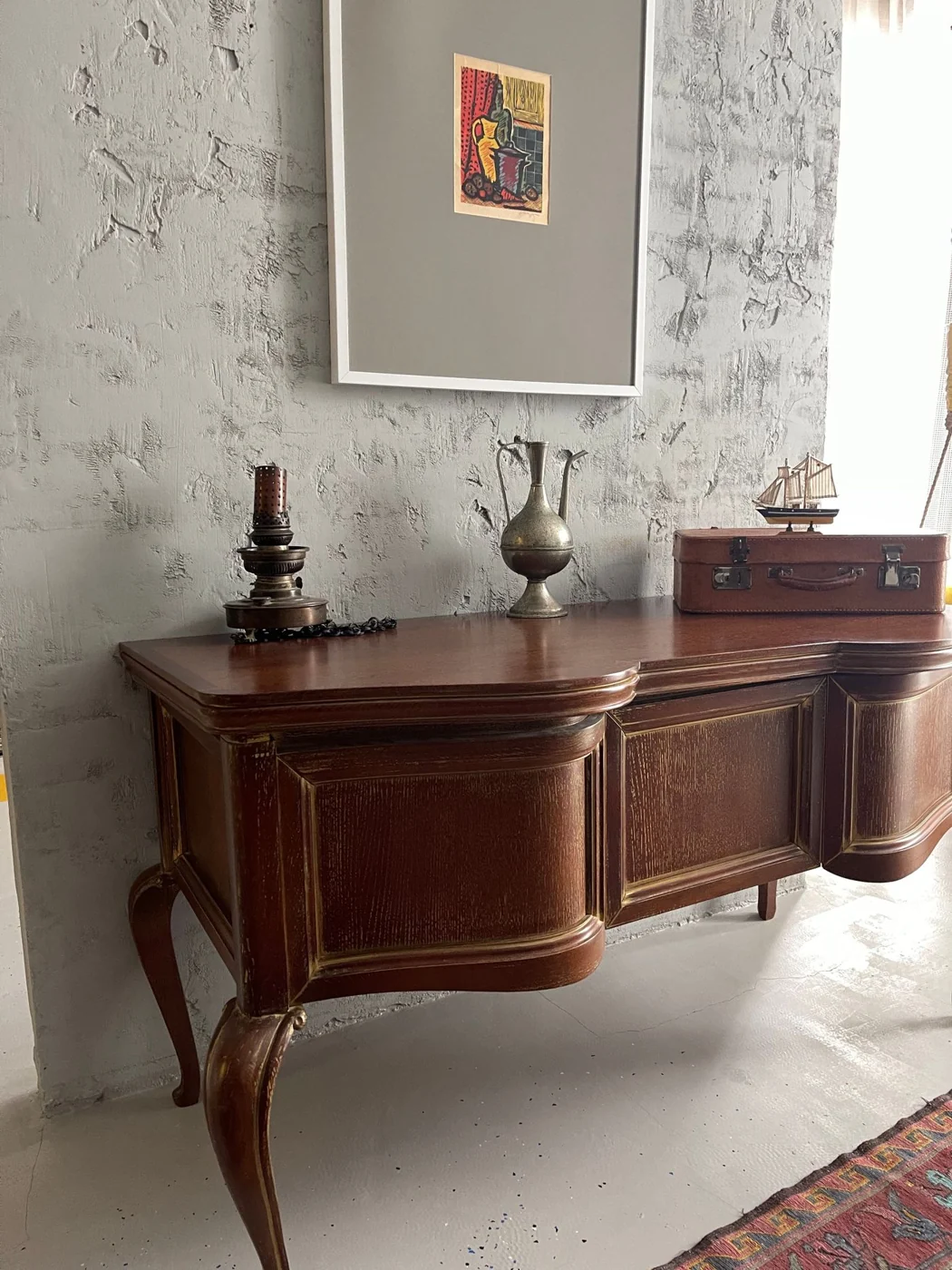 A rustic setting with a vintage dresser and antique decor, capturing a cozy interior vibe.